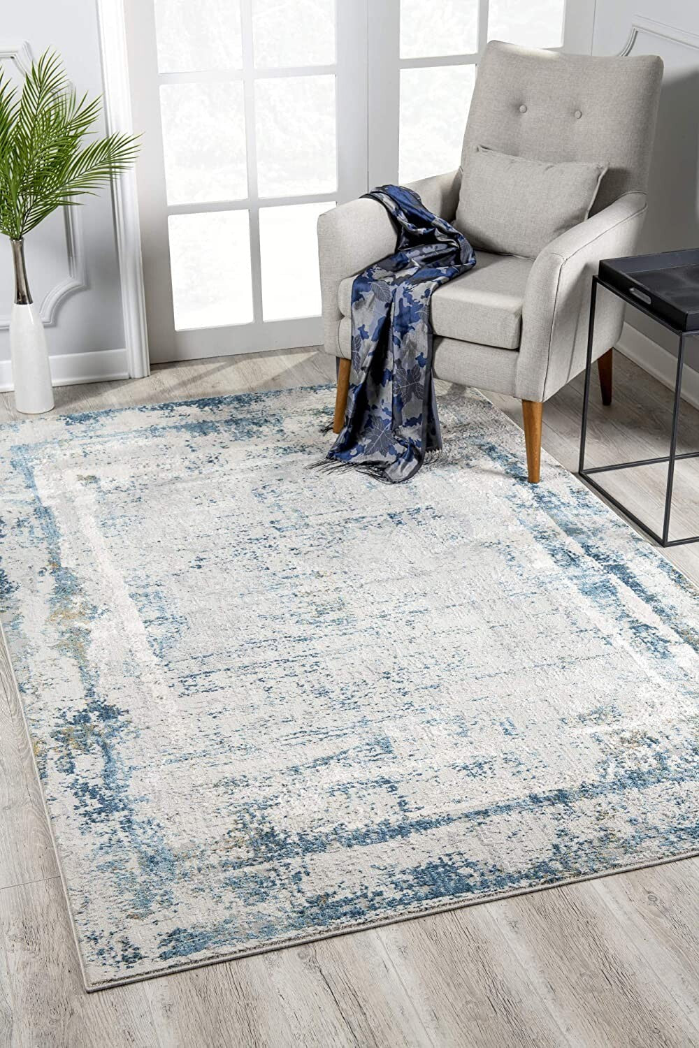 4' X 6' Ivory And Blue Abstract Distressed Area Rug